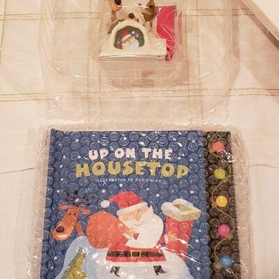 Lot 924: NEW Hallmark "Comet" Plushie Reindeer and Hallmark "Up on the Housetop" Book and Interactive Ornament 