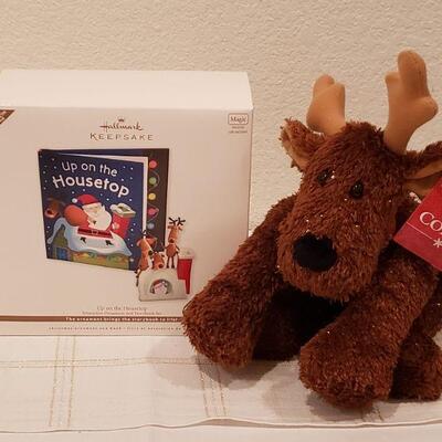 Lot 924: NEW Hallmark "Comet" Plushie Reindeer and Hallmark "Up on the Housetop" Book and Interactive Ornament 