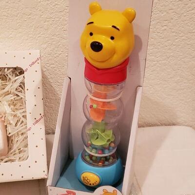 Lot 927: NEW Dillard's Baby Ornaments, Angel Bear and Winnie the Pooh Rattle Toy