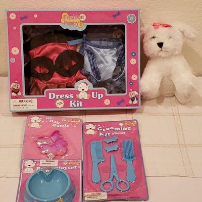 Lot 944: NEW Puppy and Puppy Dress Up, Grooming and Feeding Sets