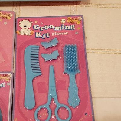 Lot 944: NEW Puppy and Puppy Dress Up, Grooming and Feeding Sets