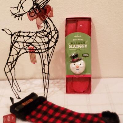 Lot 945: NEW Hallmark Artist Stocking, Reindeer and Animated Wreath Hanger