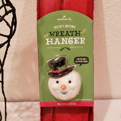 Lot 945: NEW Hallmark Artist Stocking, Reindeer and Animated Wreath Hanger
