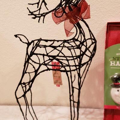 Lot 945: NEW Hallmark Artist Stocking, Reindeer and Animated Wreath Hanger