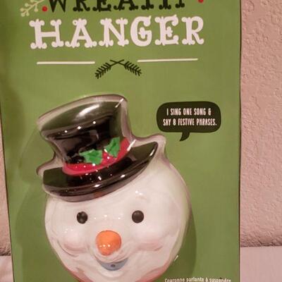 Lot 945: NEW Hallmark Artist Stocking, Reindeer and Animated Wreath Hanger