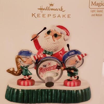 Lot 946:  NEW Hallmark Santa Magic Band Keepsake, Plushie Snowman and Holiday CD