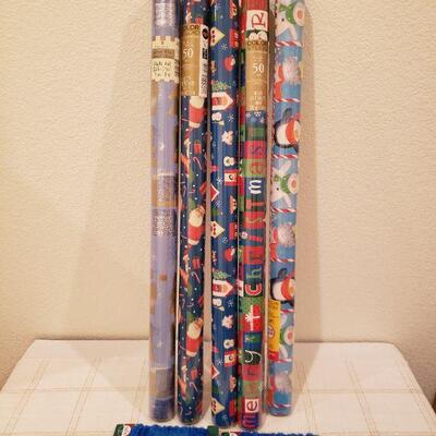 Lot 967: NEW (5) Rolls of Wrapping Paper (blues)  and Blue Fuzzy Wire Trim 