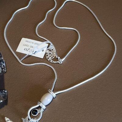 Lot 978: NEW Long Necklace with a Star Pendant & a Cuff Bracelet 