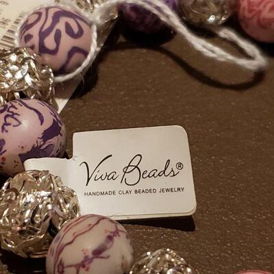Lot 985: NEW Expandable Horse Bracelet and Handmade Clay Bead Bracelet 