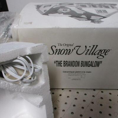 Lot 269 -  Department 56 Snow Village Series The Brandon Bungalow