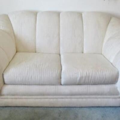 LOT 109  CREAM COLORED LOVE SEAT