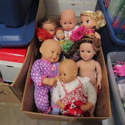 LOT 150  BOX OF BABY DOLLS TOY STORY JESSIE AND MORE