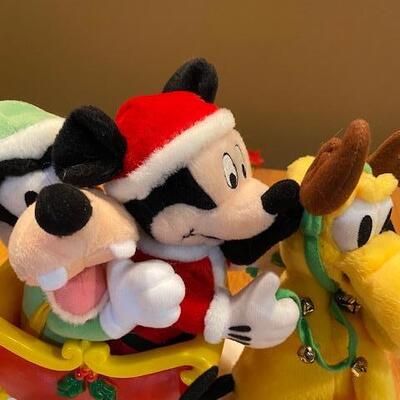 Mickey and friends on a sled