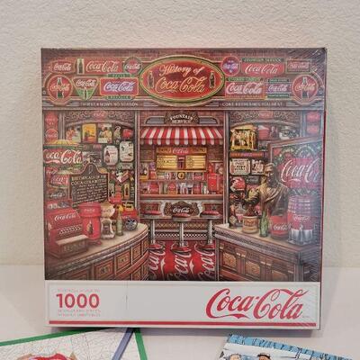 Lot 28: NEW Springbok COCA COLA 1000 pc. PUZZLE + Christmas Activity Books