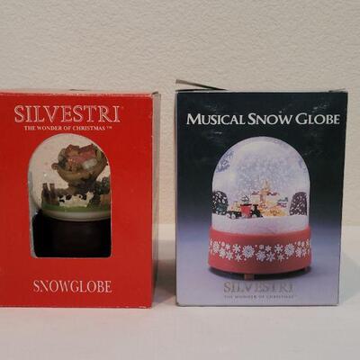 Lot 30: (2) SILVESTRI Christmas Snow Globes