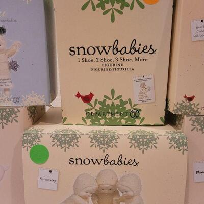 Lot 54: Assorted Dept 56. Snowbabies Christmas Figures 