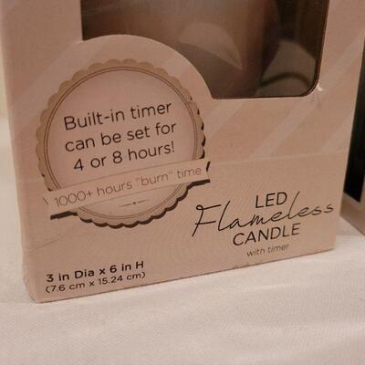 Lot 56: NEW 3" x 6" and 3" x 4" LED Candles + HALLMARK Ornaments 