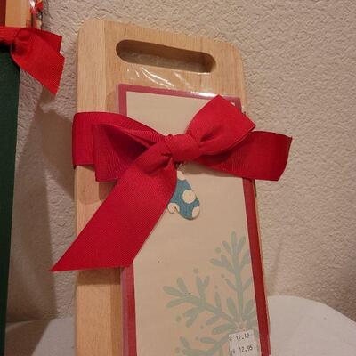 Lot 76: Set of (2) New Hallmark Christmas Cutting Blocks and (3) New Christmas Spirit Door Hangers