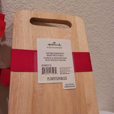 Lot 76: Set of (2) New Hallmark Christmas Cutting Blocks and (3) New Christmas Spirit Door Hangers