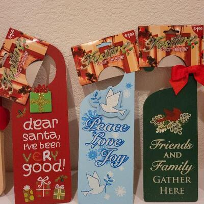 Lot 76: Set of (2) New Hallmark Christmas Cutting Blocks and (3) New Christmas Spirit Door Hangers