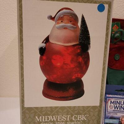 Lot 77: (2) New HO HO HO Christmas Stockings + Santa NEW LED Display