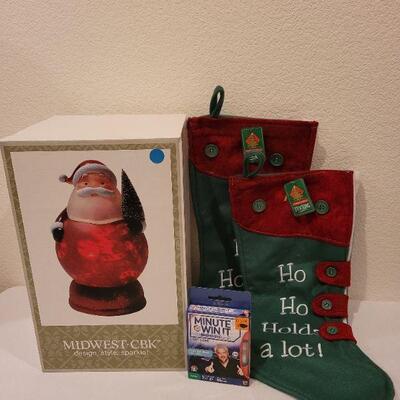 Lot 77: (2) New HO HO HO Christmas Stockings + Santa NEW LED Display