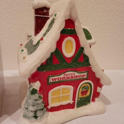 Lot 87: New Precious Moments LED Musical Tabletop Angel + New HALLMARK Santa's Workshop (needs batteries)