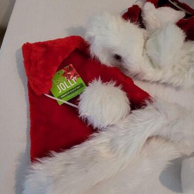 Lot 102: NEW Santa Hats (3), Santa Animated Plushie, and (2) Picture Frames