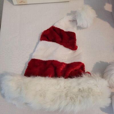 Lot 102: NEW Santa Hats (3), Santa Animated Plushie, and (2) Picture Frames