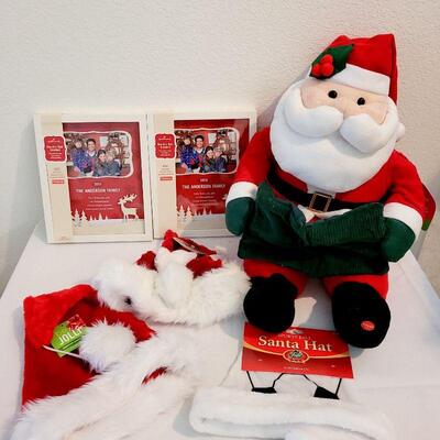 Lot 102: NEW Santa Hats (3), Santa Animated Plushie, and (2) Picture Frames