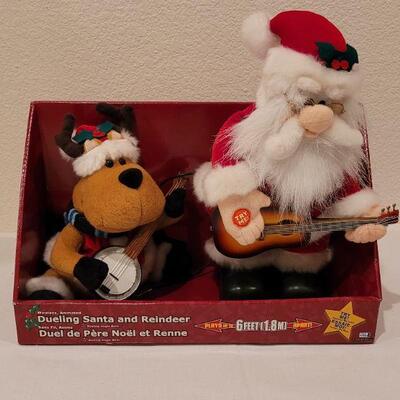 Lot 105: New Animated Dueling Santa & Reindeer 