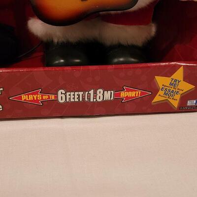 Lot 105: New Animated Dueling Santa & Reindeer 