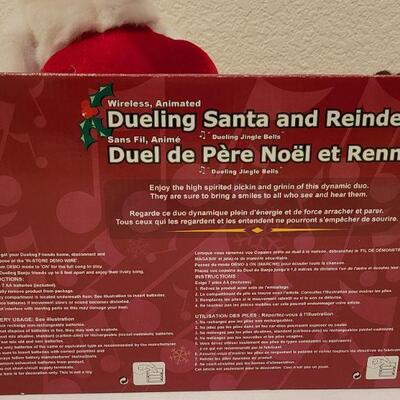 Lot 105: New Animated Dueling Santa & Reindeer 