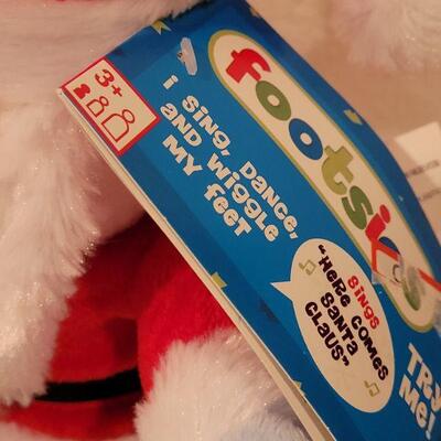 Lot 117: NEW Gift Lot  Activity Pad, Puzzle, Crayola Color Socks and Animated Santa 