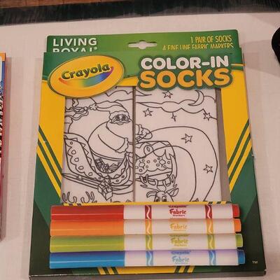 Lot 117: NEW Gift Lot  Activity Pad, Puzzle, Crayola Color Socks and Animated Santa 