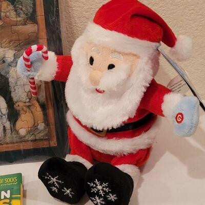 Lot 117: NEW Gift Lot  Activity Pad, Puzzle, Crayola Color Socks and Animated Santa 