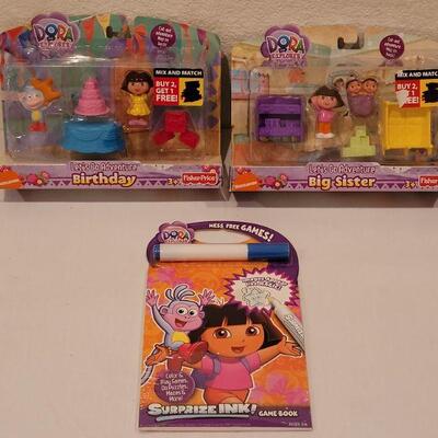 Lot 124: NEW Dora the Explore Sets (2) and Activity Pad