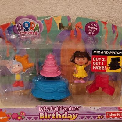 Lot 124: NEW Dora the Explore Sets (2) and Activity Pad