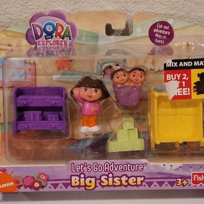 Lot 124: NEW Dora the Explore Sets (2) and Activity Pad