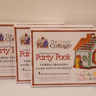 Lot 130: NEW Holiday Cheer Lot - Gingerbread Kits (3), Gingerbread Tin, Christmas Movie, Roly Poly Snowman Tin and (4) Fillable Ornaments 