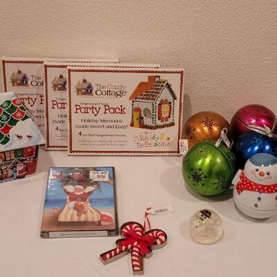 Lot 130: NEW Holiday Cheer Lot - Gingerbread Kits (3), Gingerbread Tin, Christmas Movie, Roly Poly Snowman Tin and (4) Fillable Ornaments 