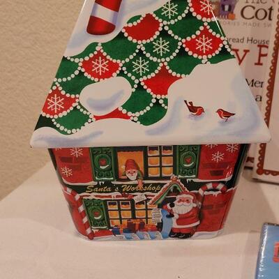 Lot 130: NEW Holiday Cheer Lot - Gingerbread Kits (3), Gingerbread Tin, Christmas Movie, Roly Poly Snowman Tin and (4) Fillable Ornaments 