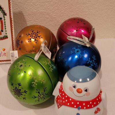 Lot 130: NEW Holiday Cheer Lot - Gingerbread Kits (3), Gingerbread Tin, Christmas Movie, Roly Poly Snowman Tin and (4) Fillable Ornaments 