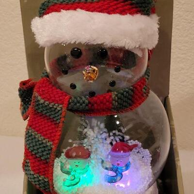 Lot 134: NEW Blowing Snow Globe Snowman and Ornaments 