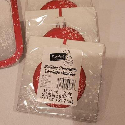 Lot 138: NEW Christmas Cheer Kitchen Lot- 6 Packages of Disposable Napkins,  Disposable Plates, Tablecloth & Snowman Tins