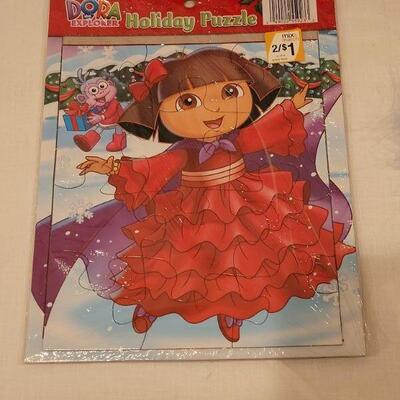 Lot 150: New (2) Dora the Explorer Play Sets, Puzzle and Holiday Bows