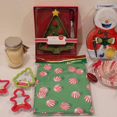 Lot 152: NEW Cookie Cutters, Tablecloth, Bowl & Plates with Spreaders, Snowman Tin and Holiday Candle