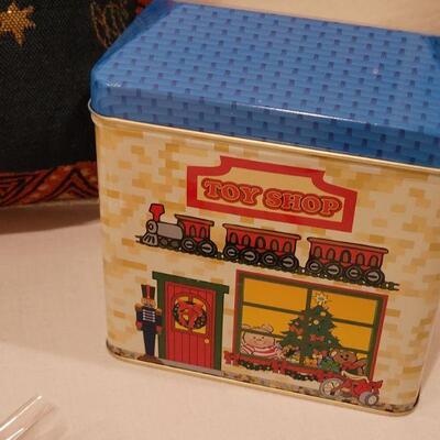 Lot 154: New Sarah Burch Pillow, Toy Shop Tin, Gingerbread Magnets and Jim Shores Cat with Garland
