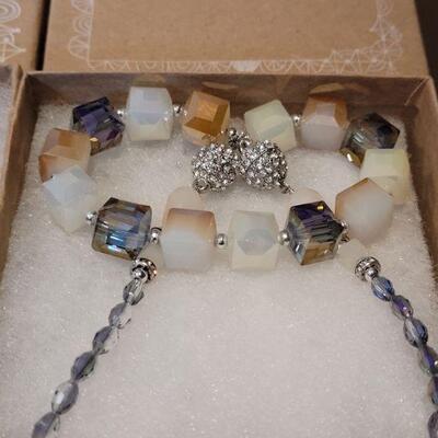 Lot 161: New Hallmark Long Blue Beaded & Chain Necklace with Blue & Gold Feathers & New Square Polished Stone & Glass...