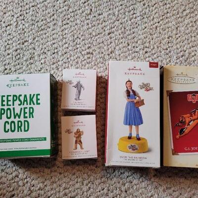 Lot 174: Hallmark NEW KEEPSAKE POWER CORD + Hallmark Christmas Ornaments feat. Wizard of Oz and G.I. JOE 